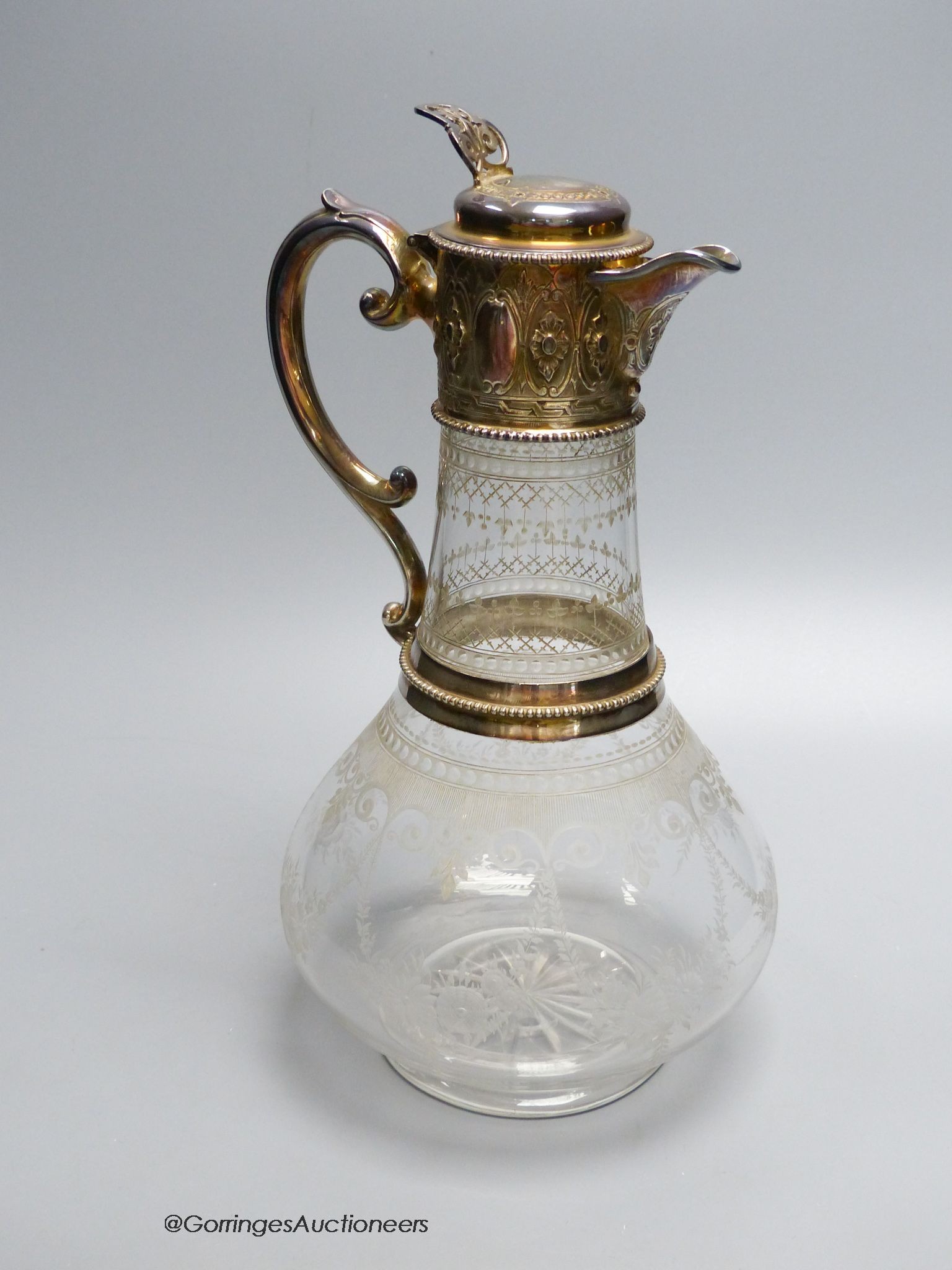 A Victorian silver mounted wheel engraved glass claret jug, by W & G Sissons, Sheffield 1868, 28 cm high